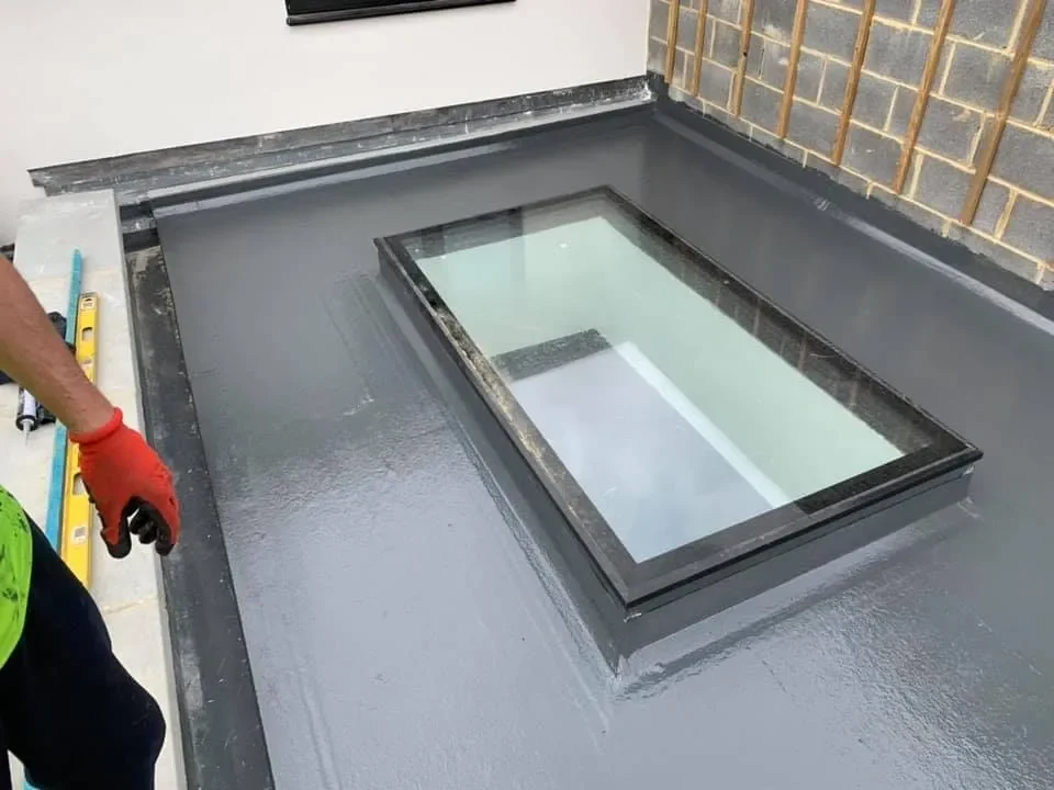 A picture of a construction worker working on a roof project